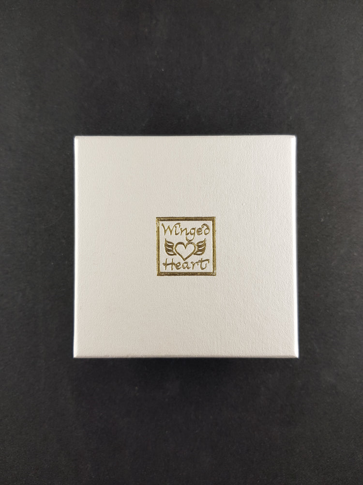 University of Glasgow paperweight box - outer view showing Winged Heart logo