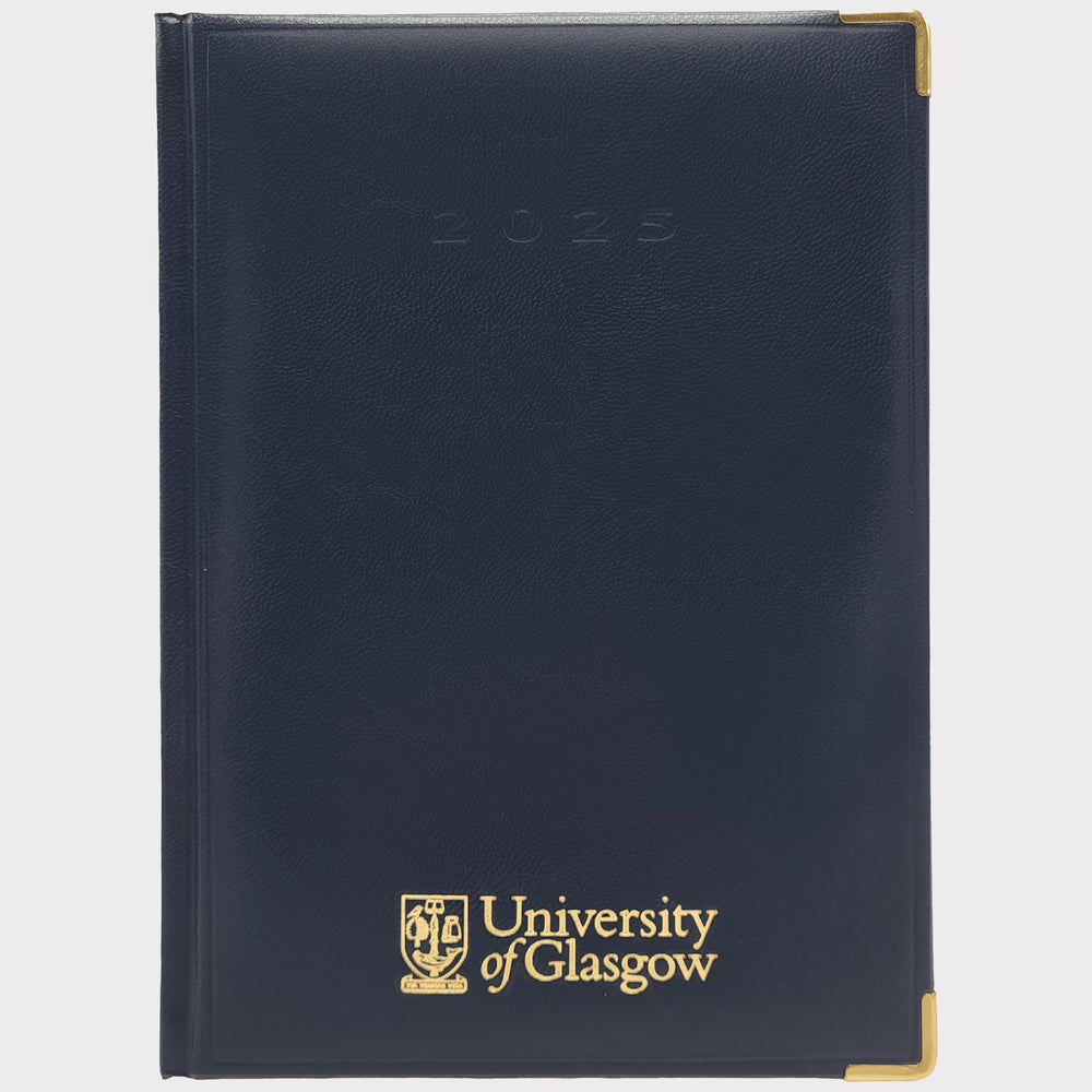 University of Glasgow AA 2025 week to view diary. Navy faux leather. UofG logo embossed in gold on bottom centre. 2025 embossed in navy centre top. Gold corner protectors.