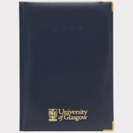 University of Glasgow AA 2025 week to view diary. Navy faux leather. UofG logo embossed in gold on bottom centre. 2025 embossed in navy centre top. Gold corner protectors.