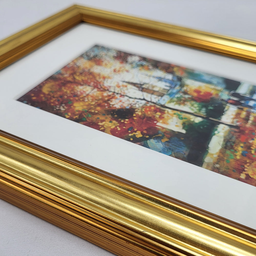 Framed artwork with a gold frame on a white background