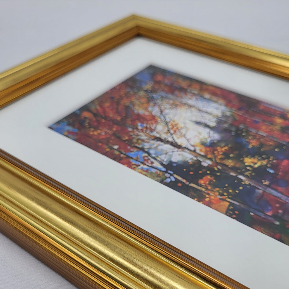 Framed artwork with a gold border on a white background