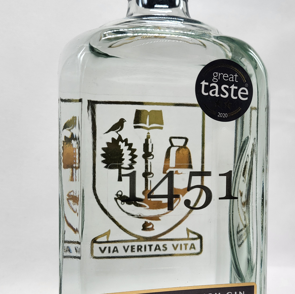 Bottle of 1451 gin with a 'Great Taste' 2020 label on a white background