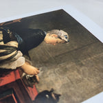 Greetings card featuring the painting A Lady Taking Tea by Jean Simeon Chardin (1735). The painting depicts a lady in elegant eighteenth-century dress seated at a red table with a teapot, teacup and saucer in front of her.