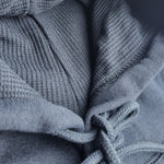 Close-up of textured blue fabric with a focus on pattern and texture.