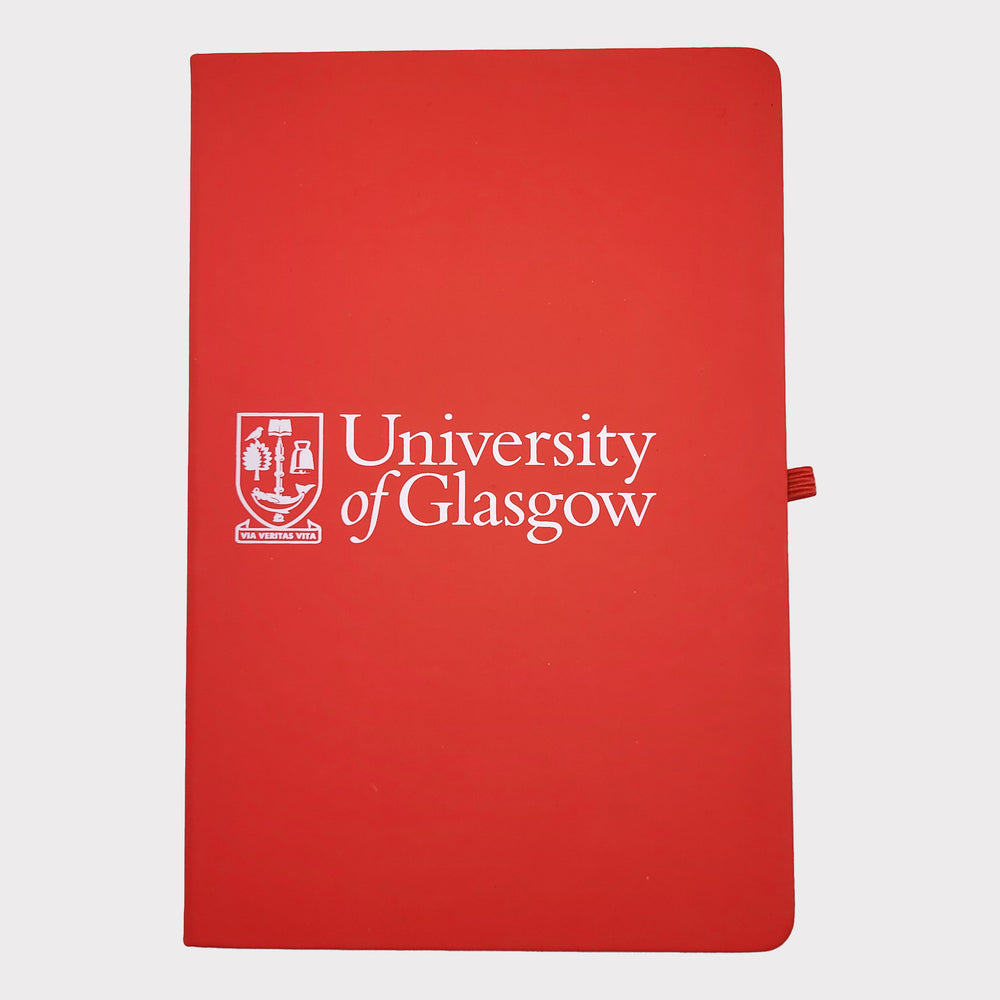 University of Glasgow Red A5 Notebook. The UofG crest is printed in white in the centre of the cover. The notebook has a red closure band and a red ribbon marker.