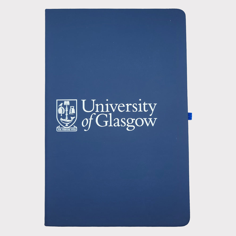 University of Glasgow Navy A5 Pocket Notebook. The UofG crest is printed in white in the centre of the cover. The notebook has a navy closure band and a navy ribbon marker.