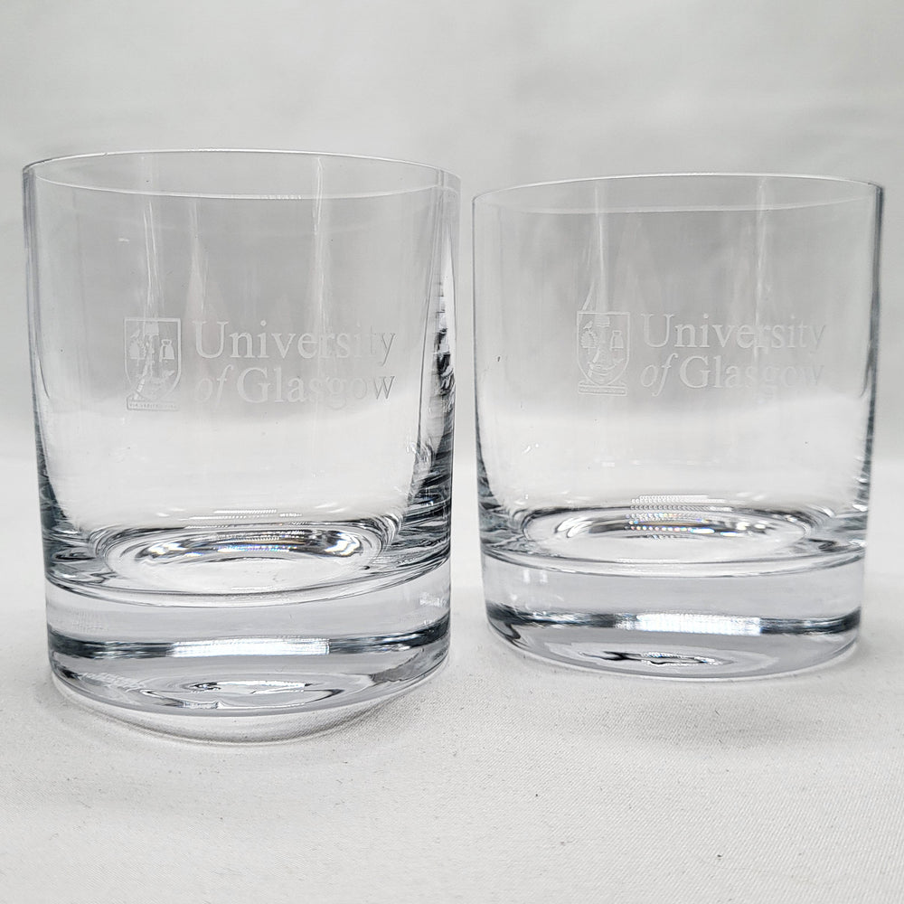Two clear glass tumblers with 'University of Glasgow' engraving on a white background