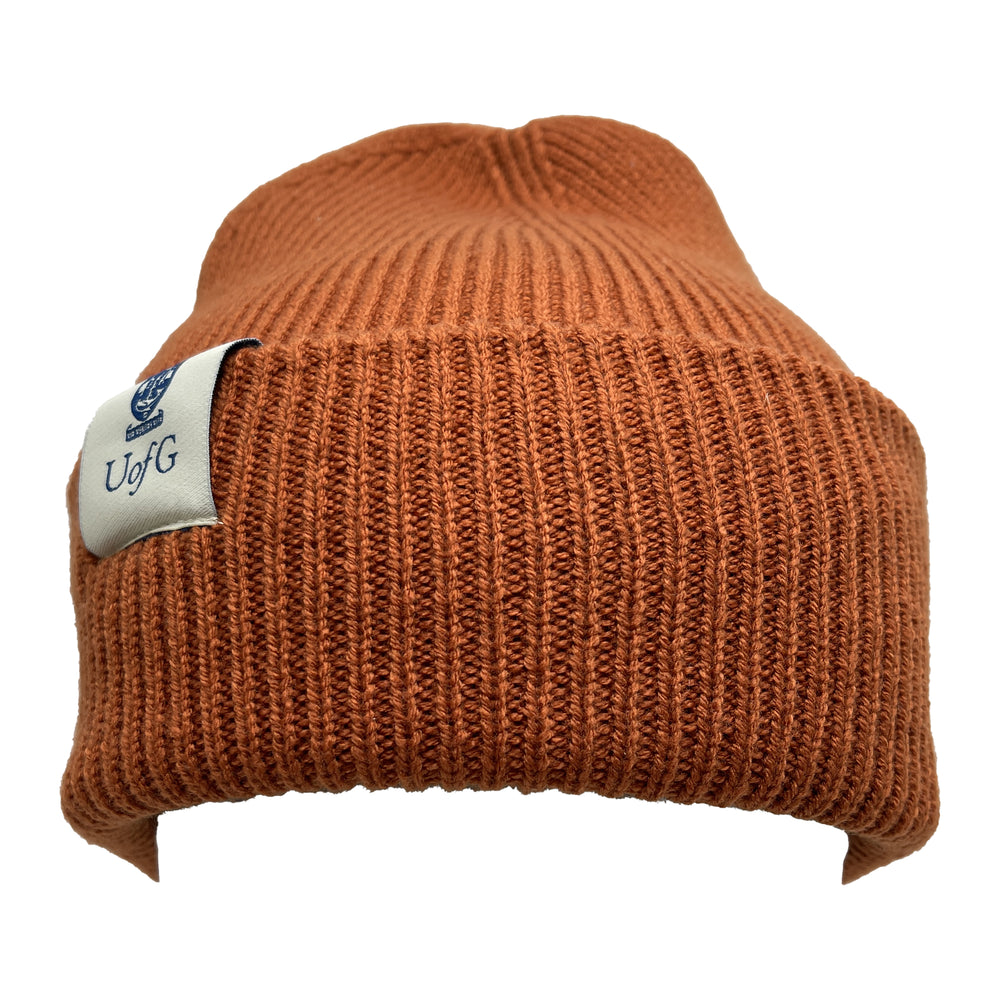 Brown knit beanie with a visible brand label on a white background