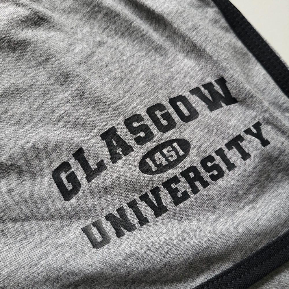 Gray fabric with 'Glasgow University 1451' text printed on it