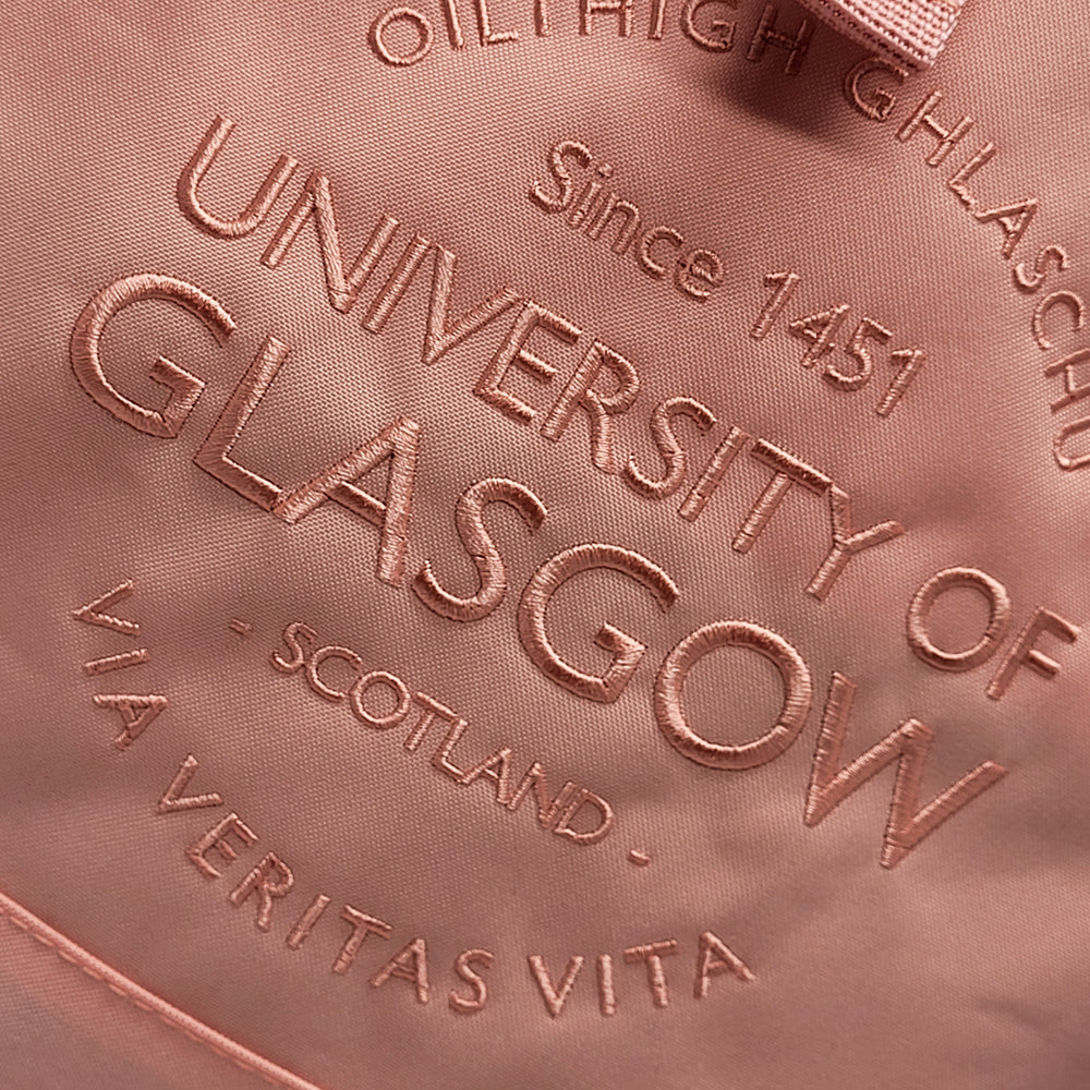 Embossed text on a pink background reading 'University of Glasgow, Scotland, Via Veritas Vita'.