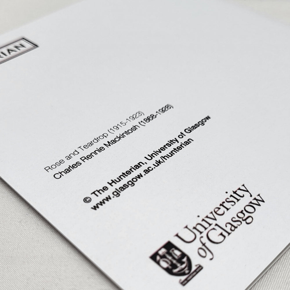 Image shows the reverse of the Rose and Teardrop greetings card. The back of the card is white with the title and other information printed in black. The Hunterian logo and the University of Glasgow crest are also printed in black.