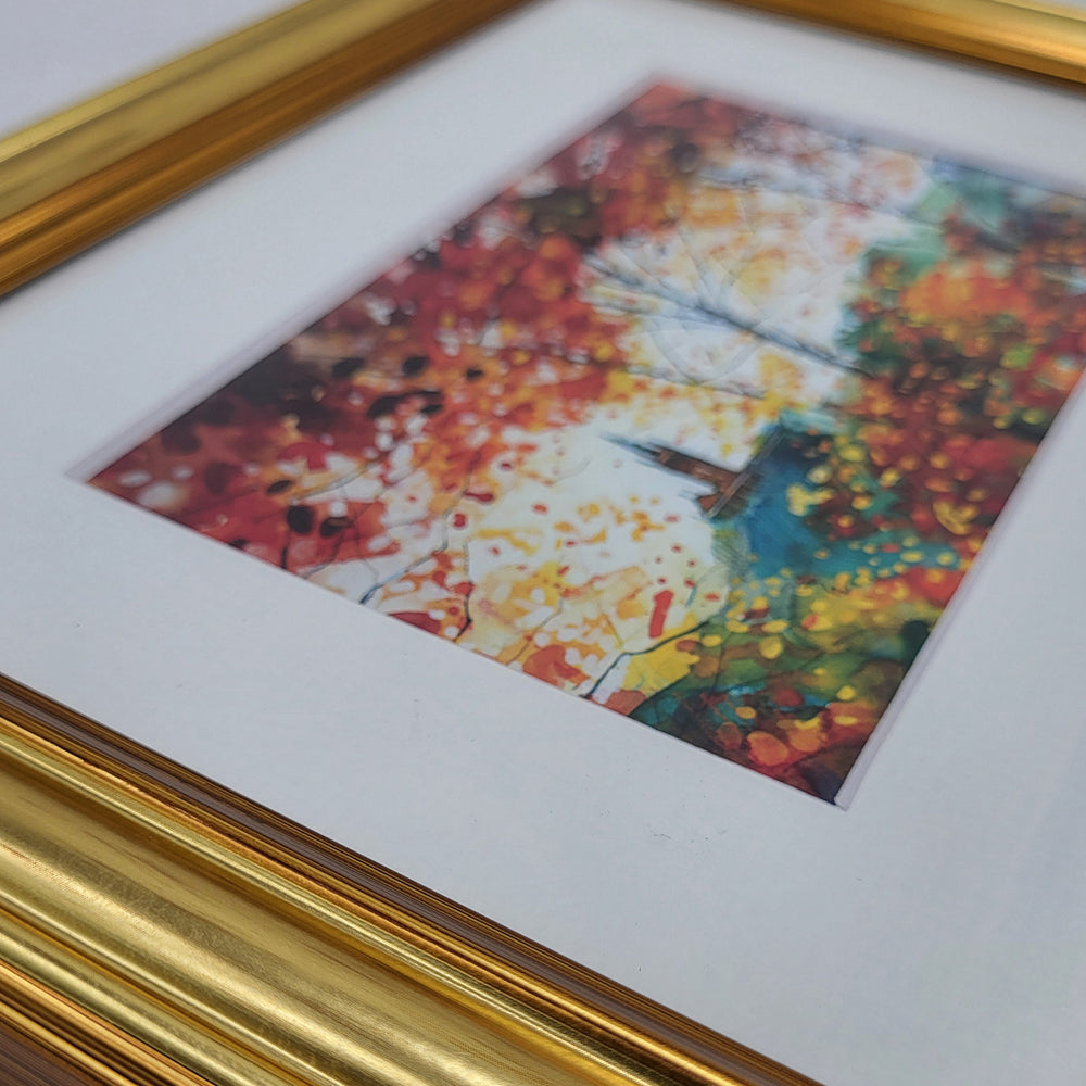 Framed abstract artwork with a gold frame