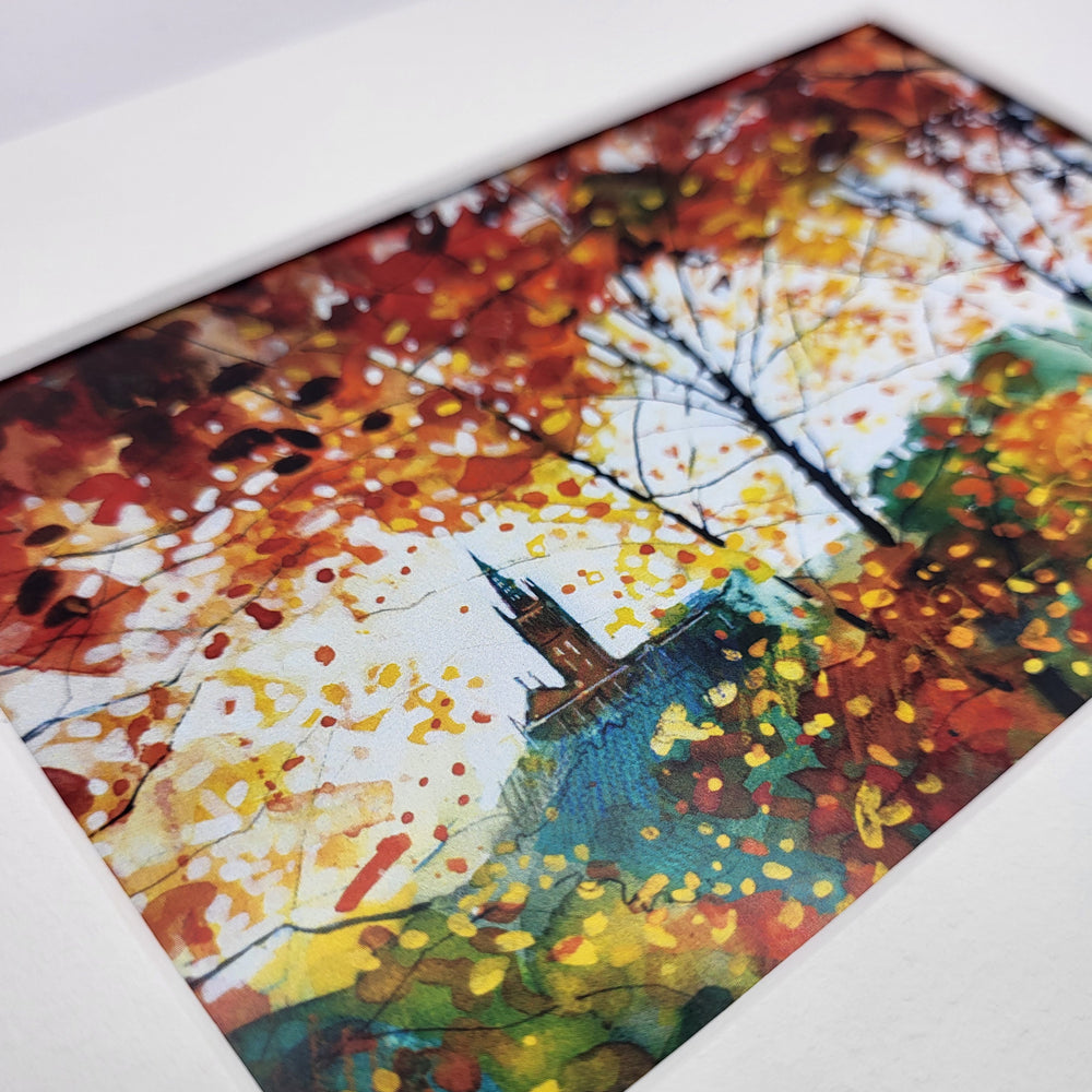 Colorful abstract art piece with autumnal colors on a white background