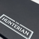 Close-up of a black sketchbook with 'The Hunterian' logo in white.